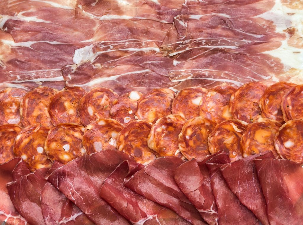 Composition Of Italian Cured Meat Types. Salami, Bresaola And Prosciutto Di Parma Slices, Top View